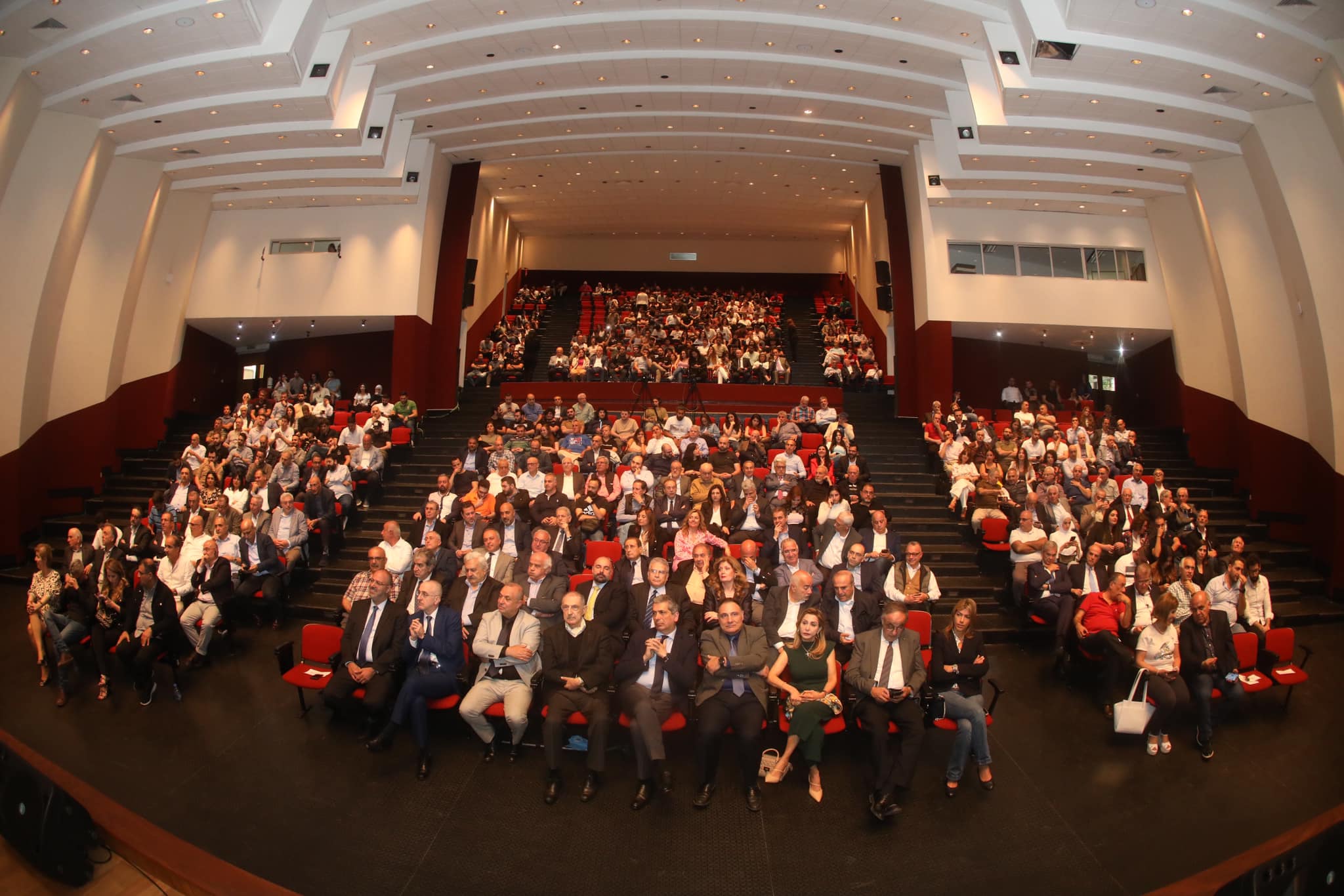 Auditorium gathering for the 2024 launch of Salon des Anciens, ESIB–USJ