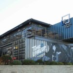 Level Two by WELD Architecture — stacked shipping containers, restaurant terraces and planted outdoor spaces
