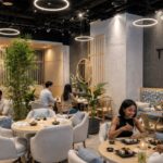 Tsunami restaurant interior by WELD Architecture, with timber screens and circular pendant lighting